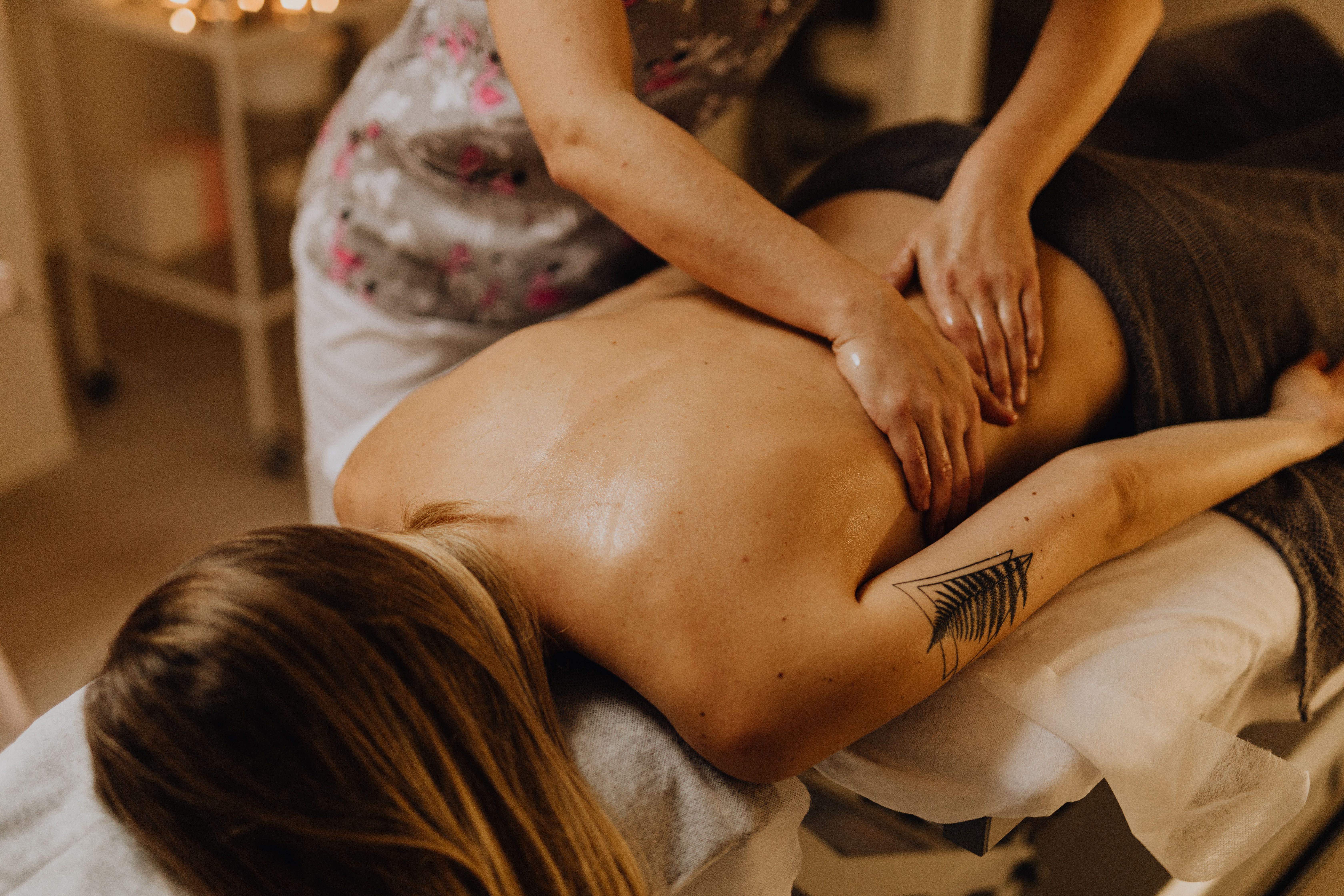Massage therapist working on a client's back